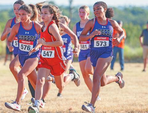 Freshman Lilly Benson begins to set her pace in the Girls' run. Photo by: Mark Martinez