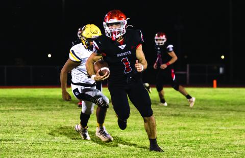 Aspermont's Kolby Bradshaw breaks free for long run towards the endzone during the Hornets 44-64 loss to Loraine last Friday night. The Hornets move to 2-3 on the season and will take on the Rotan Yellowhammers this Friday in Rotan at 7pm in their last match before district play. Photo by: Mark Martinez
