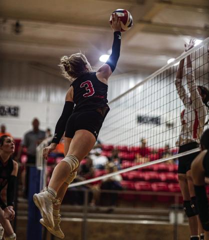 Lady Hornet Junior Mylee Van Meter fires a kill over Lady Dragon defenders during Aspermont's 3-0 win over Paducah this past Saturday. PHOTO BY MARK MARTINEZ