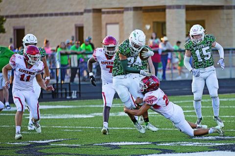 Aspermont's Carson  Guidry wraps up the opposing Hornet ball carrier in last Friday's 34-28 win over Blackwell.