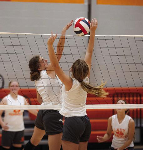 Senior Tylee Fillingim meets Freshman Talyn Lewis at the top of the net. Photo by Mark Martinez