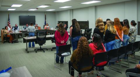10 potential team members and a room full of supporters listen along as students and parents urge Rotan ISD Trustees to help students compete in the upcoming softball season.