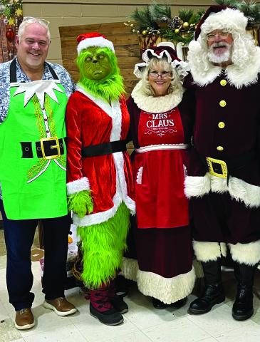 Santa and Mrs. Claus popped into town last week for the Stonewall Memorial Hospital District Christmas party, catching up with the Grinch and another jolly old elf, SMHD CEO Michael Moorhead.