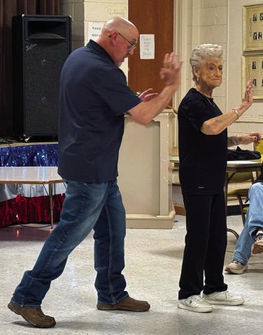 Mildred Crouch of Hamlin, Texas learns self-defense techniques in Old Glory Saturday afternoon at the women's self-defense seminar conducted by Scott Feagan and coordinated by Jan Harris.