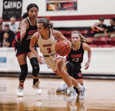 Left: Roby Senior Chasity Benson weaves passed Lady Tiger defenders during the Lady Lions' narrow 48-53 loss to Anson Tuesday night. The Lady Lions will next take the court against Jayton in Jayton at 5pm this Friday. PHOTO BY: TRICIA HURT