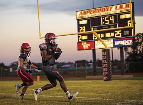 Aspermont senior Donovan Miller hauls in a pass for a touchdown.