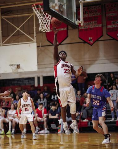 Aspermont's Donovan Miller lays up a shot during the Hornets 60-71 loss to Knox City last Friday night. The Hornets finished district play with a record of 11-1, tieing with the Greyhounds. Aspermont and Knox City will compete one more time to determine playoff seeding this Friday night at 6pm in Rule. PHOTO BY TRICIA HURT