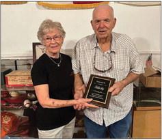 Jerry Fry accepted a plaque presented by Dot Harris in memory of Bettie Fry and her long-time service and dedication to the museum and the Historical Commission.