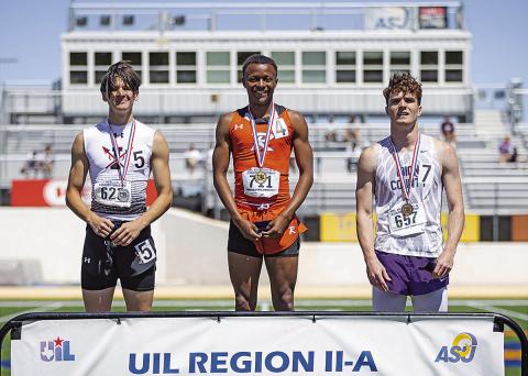 Rotan Senior Jordan Daniel is all smiles as he stands on the podium in the first place spot. Jordan will be advancing to the state meet in the 100 m and the 200 meter dash. He placed 1st in both events at the Regional meet held last weekend at Angelo State University. PHOTO BY MARK MARTINEZ