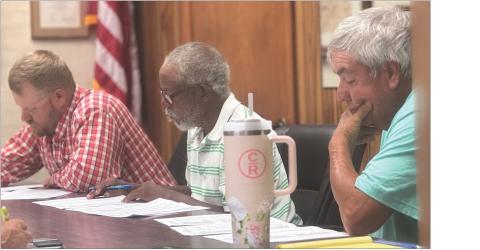 Rotan City Council members Tanner Park, Scott Toliver, and Frank Miranda read through the city's anticipated revenues and expenditures during a special-called budget workshop last week. photo by jeff hurt