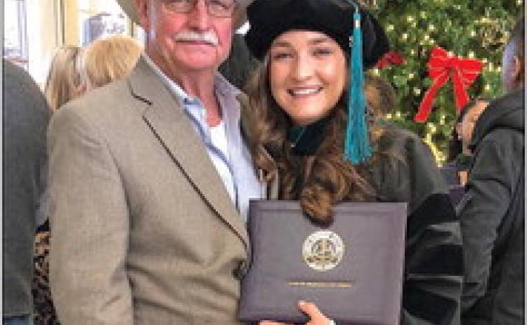 Whitney Helms earns Doctorate degree