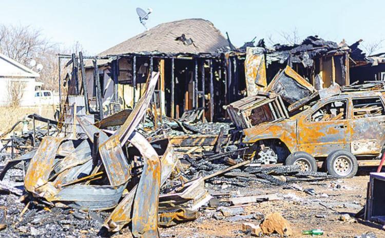 . Smoldering remains of the historic Roby home that was detroyed on December 23, 2021. Photo by: Mark Martinez