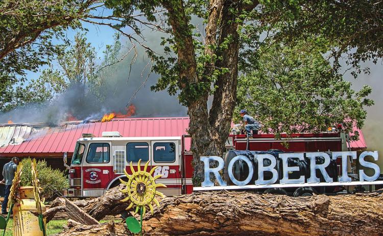 Firefighters work to extenguish the blaze that destroyed the residence of Harold Roberts on June 11, 2022/