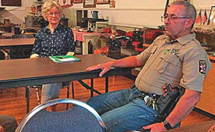 President Dot Harris and others enjoyed Sheriff Randy Ford's presentation at the Fisher County Historical Commission's October 5th meeting.