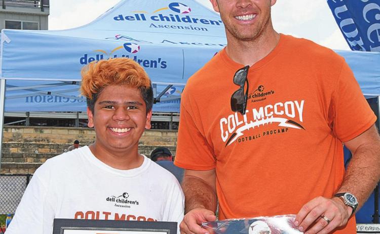 Draven Yanez of Rotan ( left) is awarded Camper of the Day at the Colt McCoy Youth Pro-Camp in Austin, TX. The son of Zach &amp; Rose Yanez of Rotan, Draven (12) will be entering the 7th Grade where he intends to play Jr. High Football for the Yellowhammers.