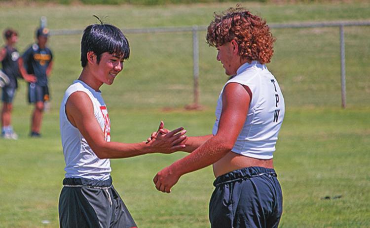 Aspermont's Toma Onishi &amp; Rotan's Zac Flores shake hands.