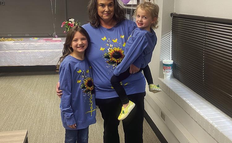 Proud mom, Sherrie Davis, along with her two daughters, Jahzlyn and Acelyn after Tuesday's adoption proceeding at Rotan ISD.