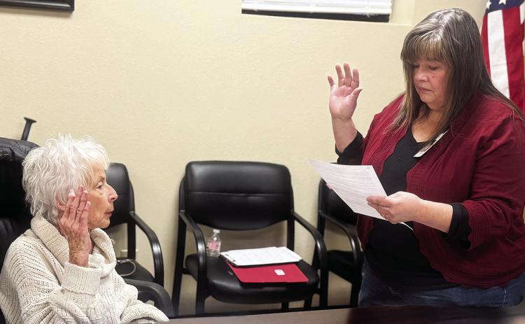 SMHD Human Resources Director Maryellen Coats gives newly appointed SMHD Director Claire Clarke her oath of office during the board’s January 12 meeting. JEFF HURT