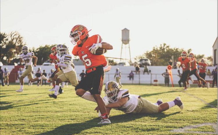 Rotan Sophomore Cristian Garcia slips a defender for a big run during the Hammers 26-39 loss to the Harrold Hornets last Friday night. Photo by Mark Martinez