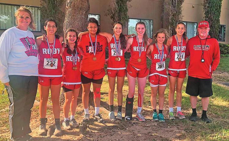 State qualifying Roby Lady Lions Cross Country Team L-R: Coach Jolana Piske, Ivy Espinzoa, Lilly Benson, Joselynn Williams, Hailee Garmer, Callie Humphrey, Chasity Benson, Hope Garmer, Coach Michael