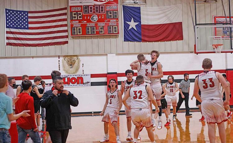 Roby Lions celebrate a hard fought victory over the Aspermont Hornets (Photo by Mark Martinez)