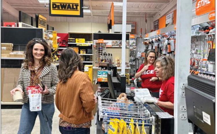 Rotan residence Buffy Sipe and Stephanie Huston share smiles in the checkout line at the newly opened Fisher Hardware &amp; Farm Supply store in downtown Rotan PHOTO BY MARK MARTINEZ.