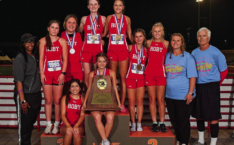 Lady Lions proudly hold their 2nd State Title in Track &amp; Field - Back Row: Coach Kim WIlliams, Saylor Smith, Callie Hernandez, Taylor Jeffrey, Hailee Garmer, Lilly Benson, Brylie Duniven, Coach Jolana Calhoun, Coach Rob Londerholm. Sitting Emma Carreon and Chasity Benson, ( PHOTO BY JIM PARKER WWW.JIMPARKERPHOTOS.COM)