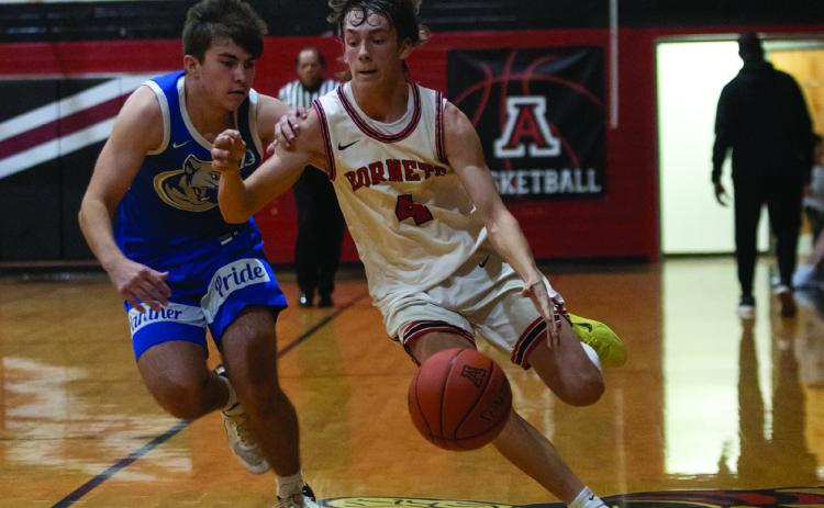 Aspermont senior Kade Morris fast breaks down the court during the Hornets 30-51 loss to Abilene Christian this past weekend at their home tournament. (Photo by Mark Martinez)