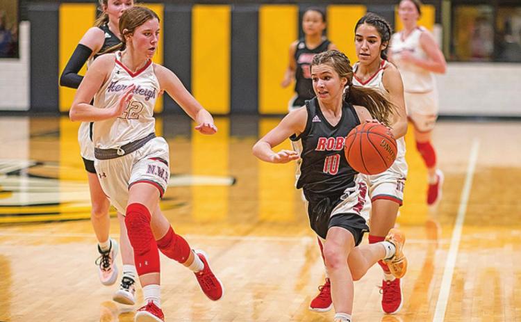 Roby's Lilly Benson races down the court last Thursday during the Lady Lions' 25-55 loss to Hermleigh. Photo by: Mark Martinez