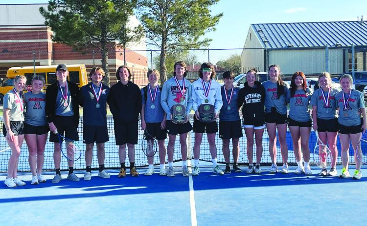 Aspermont Tennis Team L-R: Mylee Van Meter, Regan Polk, Jasper Hoppe, Jack Bell, Jaden Flores, Keltyn Van Meter, Kade Morris, Wesley Koenig, Carson Guidry, Addi Shugart, Jessi Rabel, Lizbeth Garcia, Kenzy Blankenship, Emily Blankenship. The Hornets along with claiming the team championship, also took 1st boys doubles. The team will compete at Regionals in San Angelo taking place on April 10-11. COURTESY PHOTO