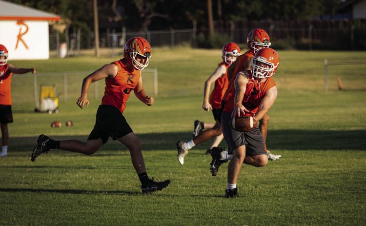 Senior Hunter Harris fingertips a pass during a defensive drill this past Monday. Photo by Mark Martinez