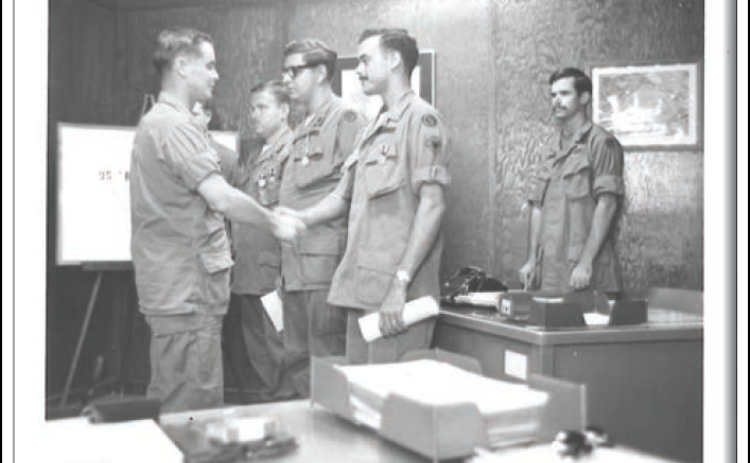 Private First Class Marshall Bennett receives the Army Commendation Medal before returning home to the United States.