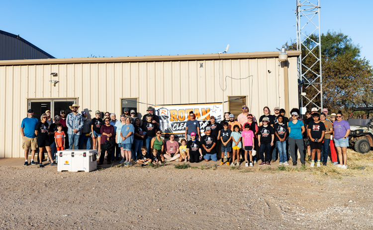 A small group of volunteers gathers early Saturday morning before heading out to their assignments during Rotan’s first community-wide cleanup day. More than 140 volunteers ultimately participated, tackling projects across town and helping remove approximately 300 cubic yards of debris. Photos by Mark Martinez.