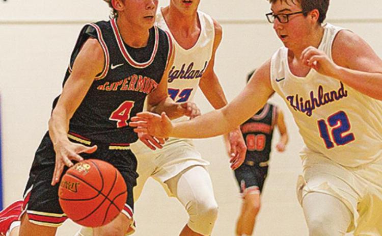 Aspermont Hornet Kade Morris, weaves through Hihgland defenders Photo by: Mark Martinez