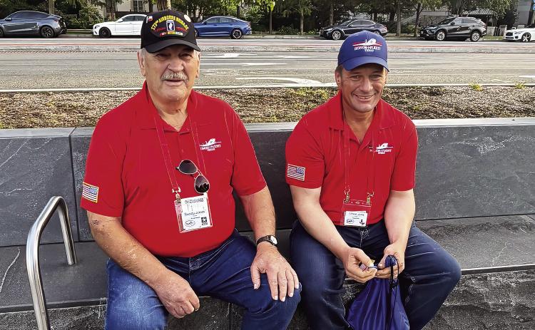Randy Jones and son Gibson takes a few moments of rest before continuing their tour of the recent Permian Basin Honor Flight to Washington DC. - PHOTO Submitted by Martha Jones