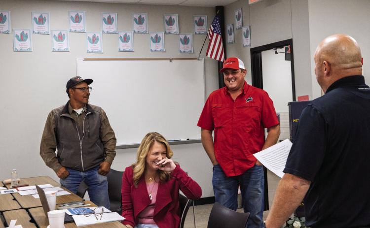 Roby CISD School Trustees take stumbling through the formalities in stride, as newly elected trustee Brent Whitfield and incumbent Danny Carrion took their oaths of office during the November 11 meeting while Whitefield's lighthearted nature cracks Trustee Michelle Terry's composure.