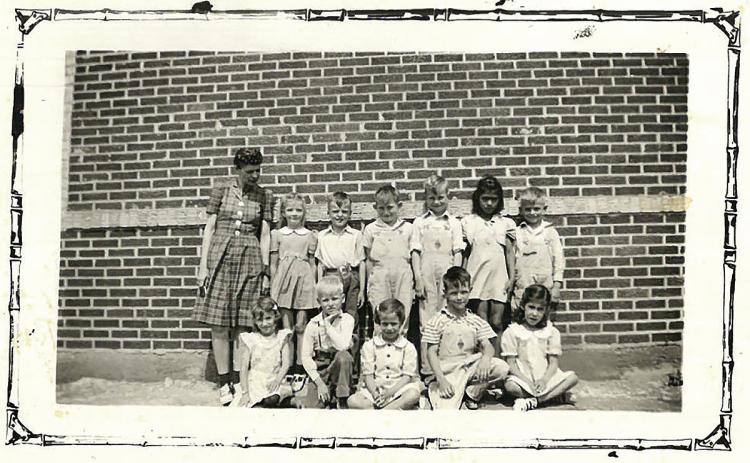 First grade Dowell 1941-42, Mrs. Gerald Collingsworth, teacher. Front row; L-R unknown, Arthur D. Greenway, Glena Faye Harrison, Jim Ashley, Eloisa Macias Back row; Mrs. Collingsworth, Medva Gartman, Darrell Hale, Jimmy Frank Wright, Doyce Ray Waddell, unknown, Frank Dean Montgomery