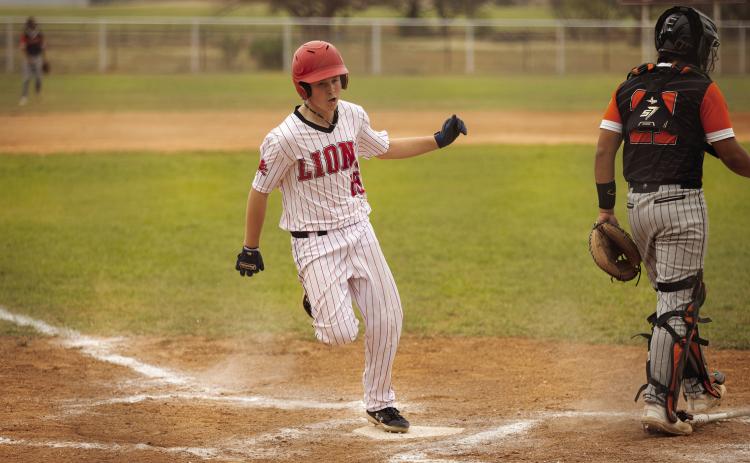 Roby's Houston Few crosses home plate to score during the Lion's 4-20 loss to the Ira Bulldogs this past Monday. Photo by Mark Martinez