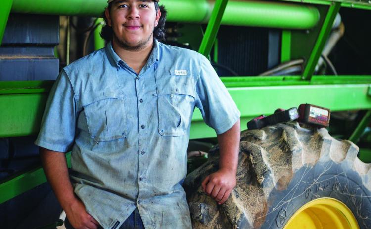 Aspermont ISD graduate and current TSTC student Mario Lopez stops to take a break on his job at United Ag &amp; Turf located in Rotan. PHOTO BY MARK MARTINEZ