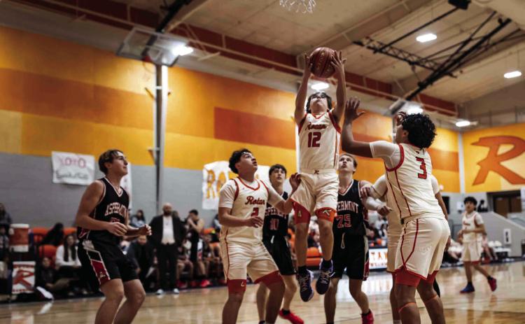 Rotan Senior Chris Newton goes up for rebound during the Hammers senior night match against Aspermont last Tuesday night. Photo by: Mark Martinez