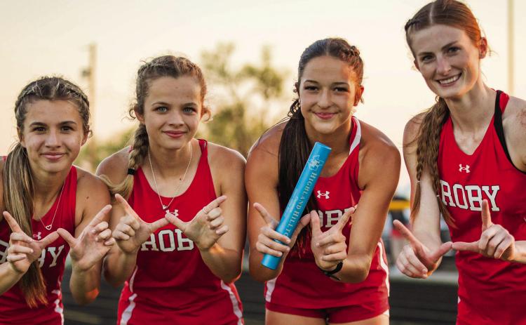 The Roby Lady Lions Mile Relay Team of Lily &amp; Chasity Benson, Hailee Garmer, and Taylor Jeffrey, are all smiles after finishing first at Jayton's Rolling Plains Relays last Friday. 14 teams competed at the meet, with the defending State Champion Lady Lions coming out on top in the Girls Division. PHOTO BY MARK MARTINEZ