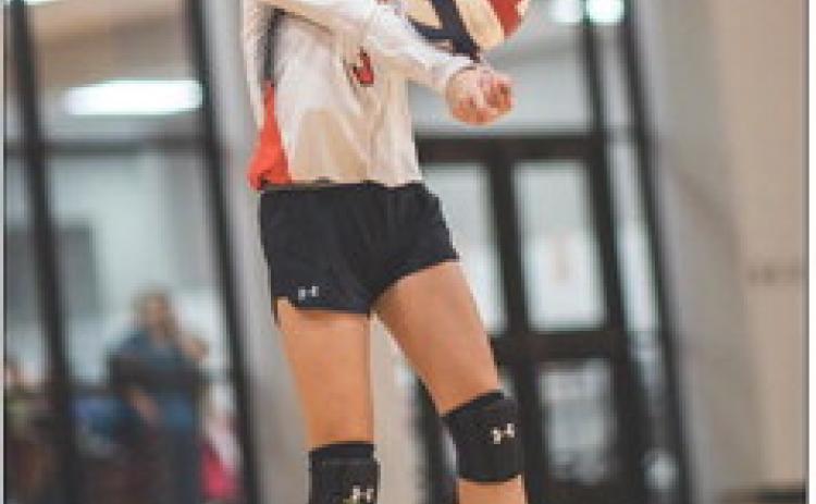 Lady Hammer Freshman Avery Gonzalez bumps up a ball during a game against Wellman-Union Tueday night. The Hammers played 4 matches against the Lady Cats, 7,8,JV &amp; V, with the 8th Grade and JV teams winning their games. Photo by Mark Martinez
