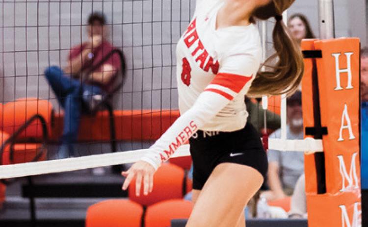Rotan's Kate Van Poppel goes up to spike the ball during the Rotan Lady Hammers match against the Texas Leadership Christian Academy Lady Eagles last Tuesday. PHOTO BY: MARK MARTINEZ