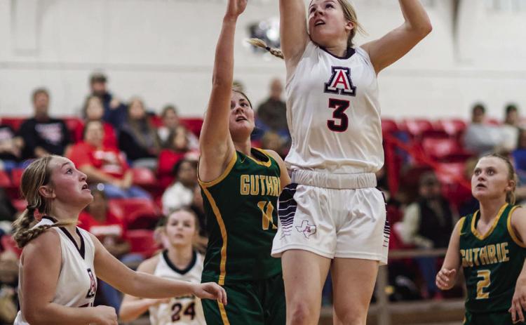 Junior Mylee Van Meter puts up a shot during the Lady Hornets 36-29 win over Guthrie. Aspermont hosted the Jaguars this past Monday for a six game holiday series consisting of four jh and two varsity contests. The Swarm ultimately ended the evening with a pefect record against Guthrie at the both jh and varsity levels. PHOTO BY MARK MARTINEZ