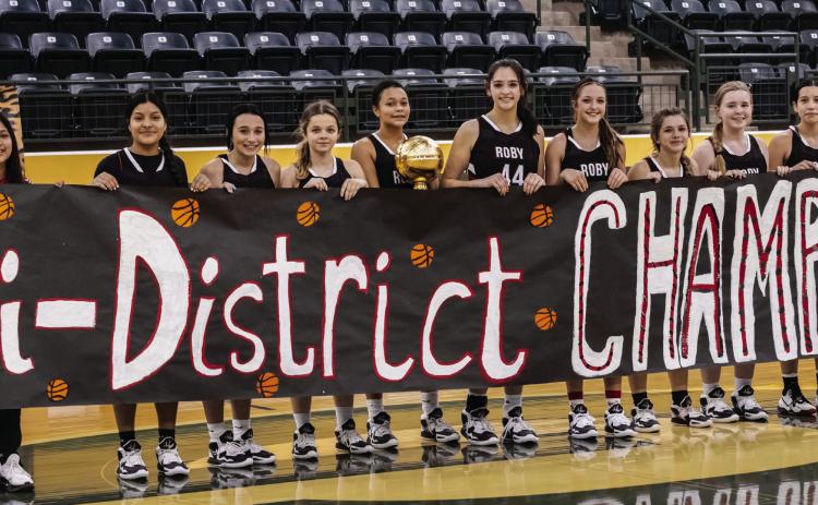 Left: Bi-District Champion Roby Lady Lion Basketball Team L-R: Carly Jimenez, Chelsea Jimenez, Avery Carreon, Chasity Benson, Joselynn Williams, Mackenzie Castillo, Hailee Garmer, Lilly Benson, Keegan McWilliams, Ivy Espinoza, Hope Garmer. PHOTO BY: TRICIA HURT