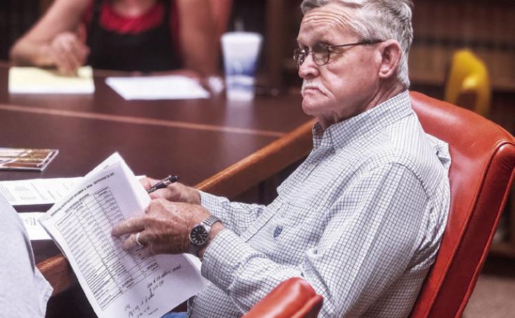 Stonewall Commissioner Gerry Messick reviews the county’s budget as the county discusses subtle changes from last year’s budget to the proposed FY 2026 budget cycle as primary tax revenue shifts from minerals to real property values. PHOTO BY JEFF HURT
