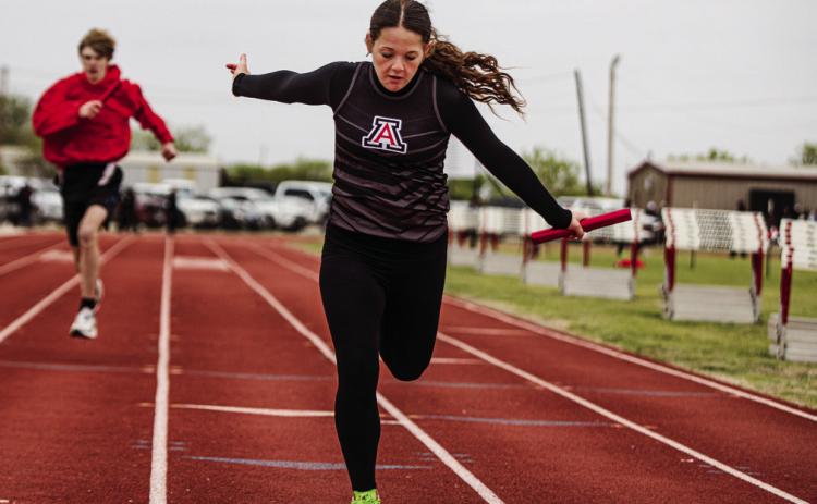 Aspermont's Macy Morris crosses the finish line during the 4x100 M Relay Photo by: Mark Martinez