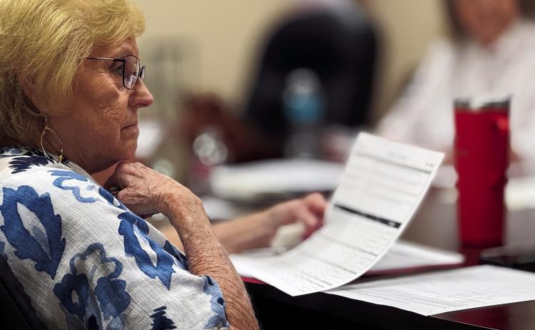 SMHD Board Secretary, Belinda Page listens attentively as the board reviews details of the proposed Swenson Solar Farm tax abatement agreement.