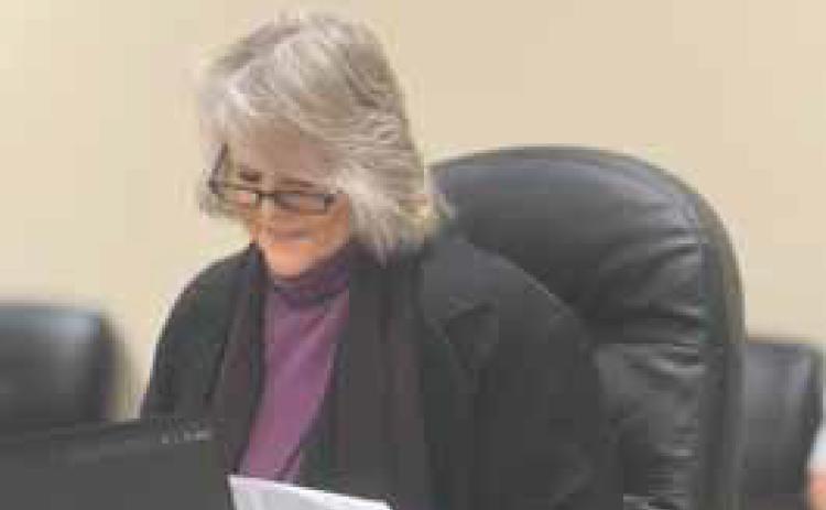 SMHD Board President Ellen Abernathy reviews the finalized Swenson Solar agreement Oct. 13. The board approved the pact unanimously, formalizing district participation in the $700 million project.
