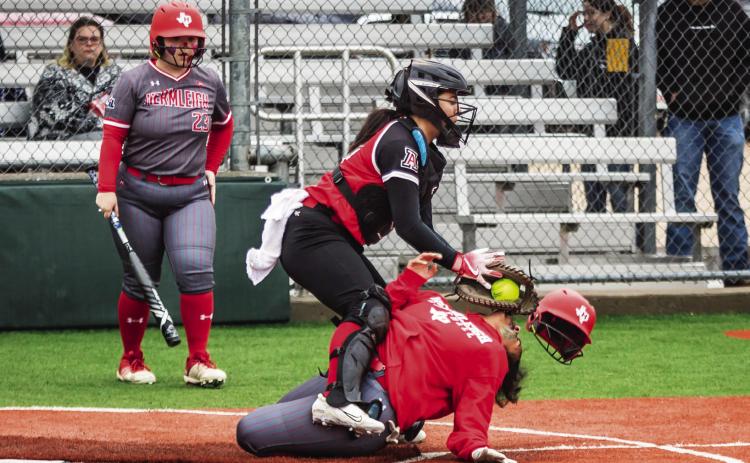 Aspermont catcher Peyton Calamaco collides with Lady Cardinal Syreah Callaway to get the out during the Lady Hornet's 0-10 loss to Hermleigh this past Saturday. Rainy conditions made for unstable play throughout the course of the game. Their next game will be on the 26th at home against Roby. Photo by: Mark Martinez